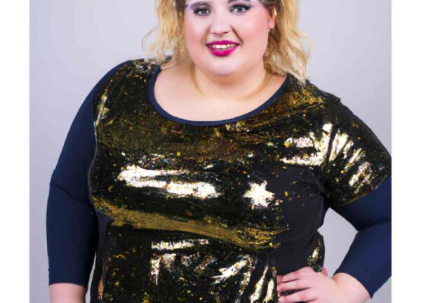 A plus size woman wearing a sequin top