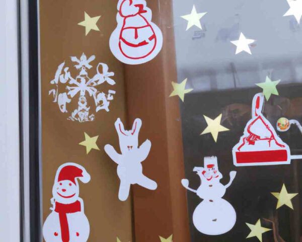 Window decorated by holiday stickers