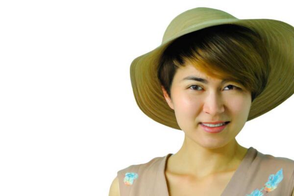 A woman wearing a Sun Hat
